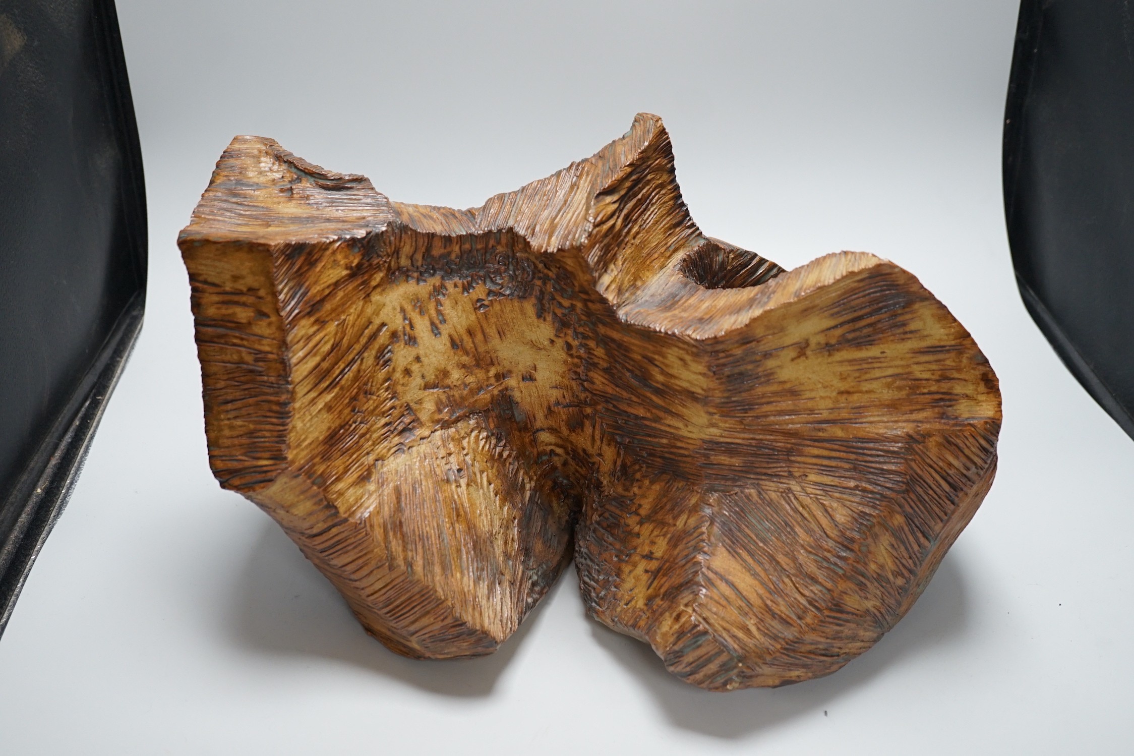 Ruth Sulke - a studio pottery copper-glaze abstract sculpture of a simulated hewn and chisled log, 43cms wide x 28.5 high